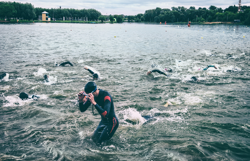 athlete half coming out of water