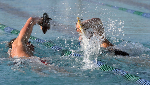 high school swimmers practicing