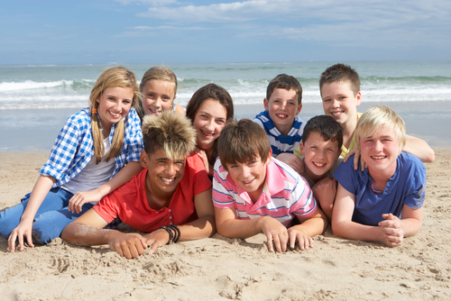 family posing together on beach