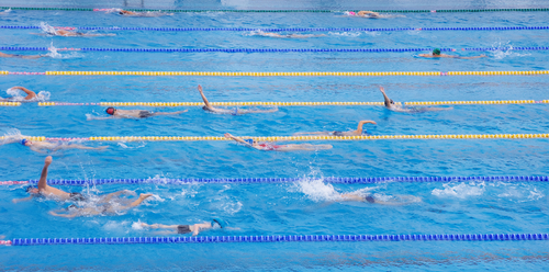 Swim team practicing in university pool