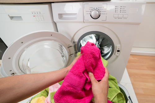 person washing towels