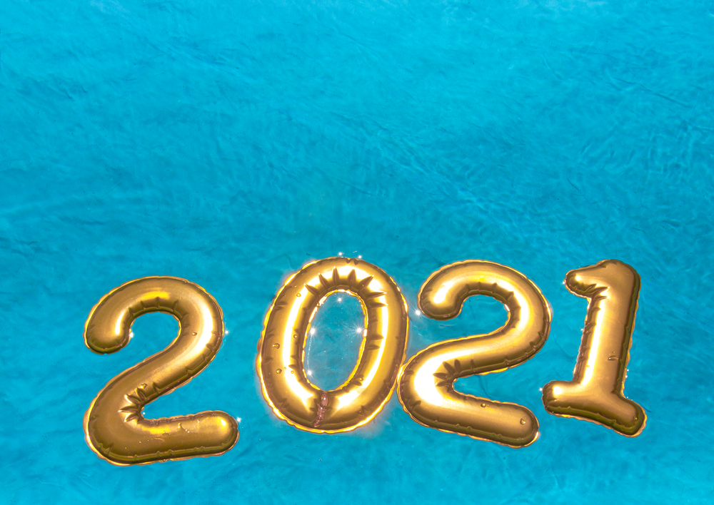 on blue azure sea water golden numbers balls 2021 new year float